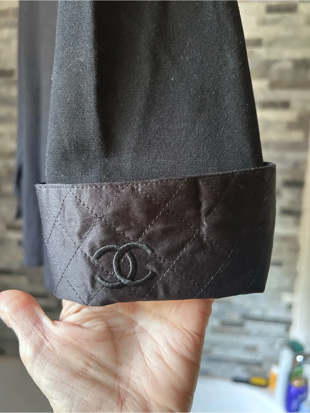 CHANEL black quilted boatneck employee uniform top